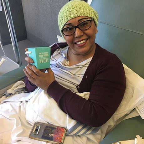 patient in chemotherapy room happy with her gift