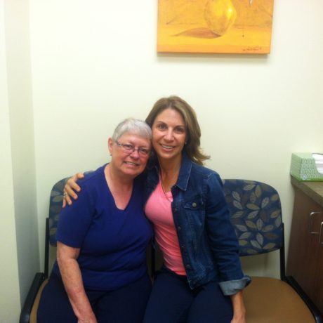 volunteer provides companionship to patient in to the chemo lounge