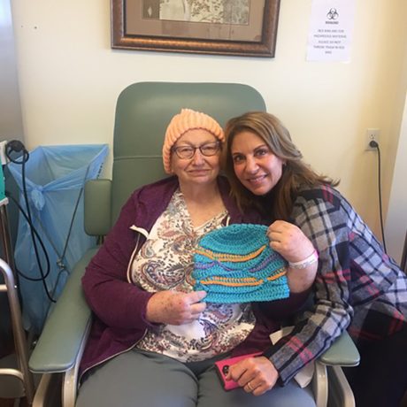 a Chemo Companions volunteer with a patient offering encouragement