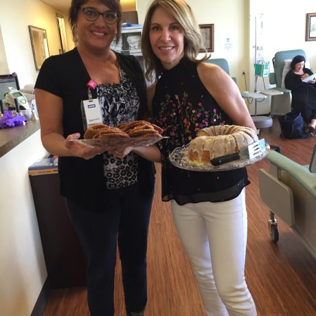 Image of a Chemo Companions volunteer with puddings to hand out to patients.