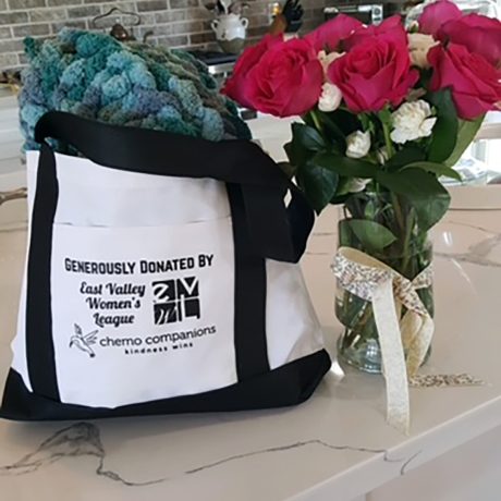 Chemo Comfort bag next to a bouquet of flowers